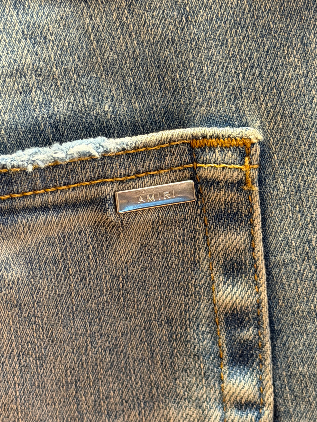 Amiri MX1 Distressed Skinny Jeans - Light Wash/Black Patches