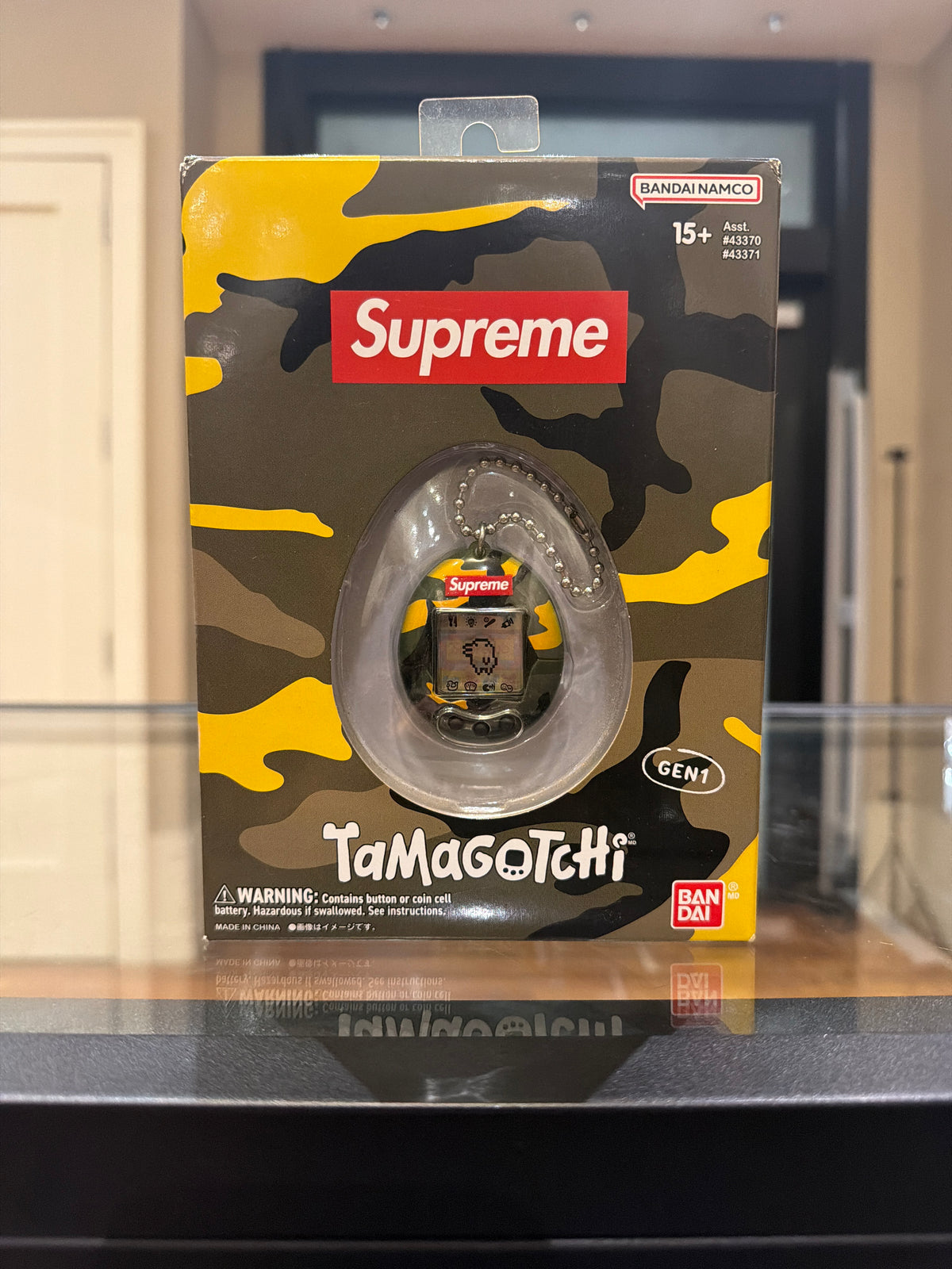 Supreme x Tomogotchi Toy
