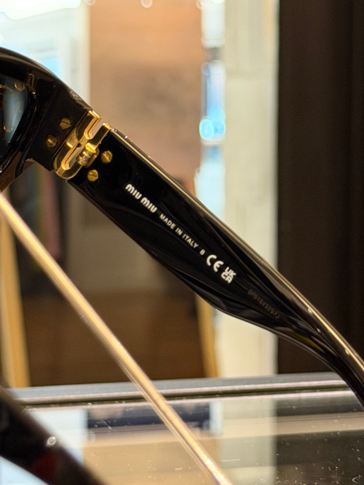 Miu Miu Mu O9WS Sunglasses In Black & Gold