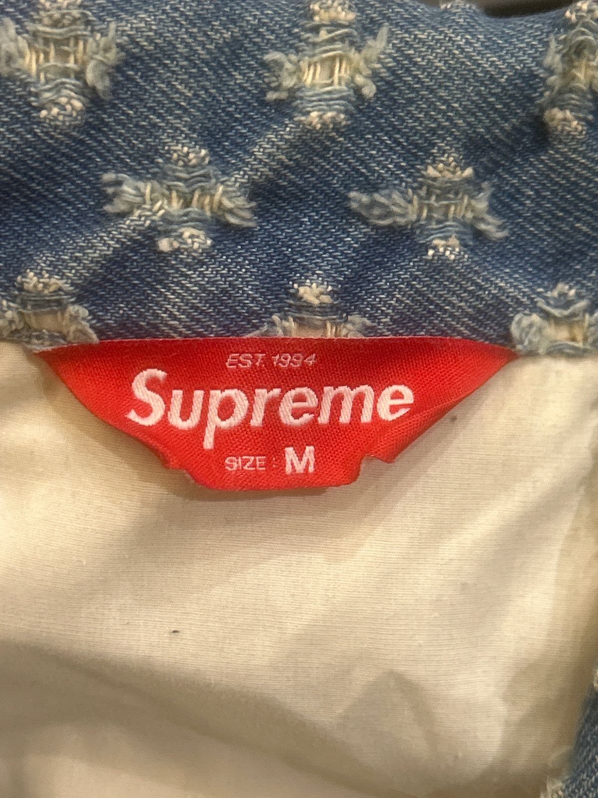 Supreme Hole Punch Denim
Trucker Jacket