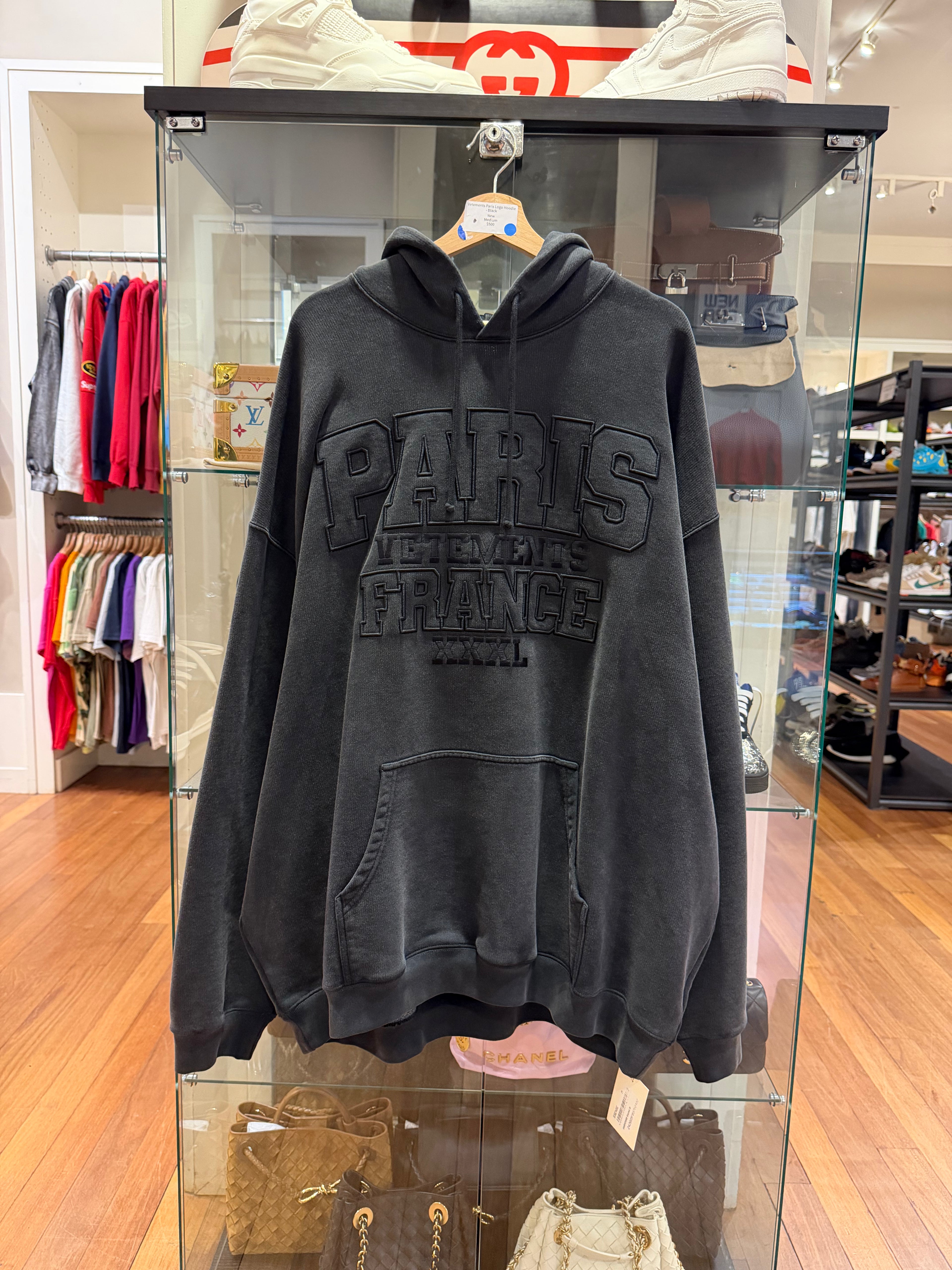 Vetements Paris Logo Hoodie
- Black