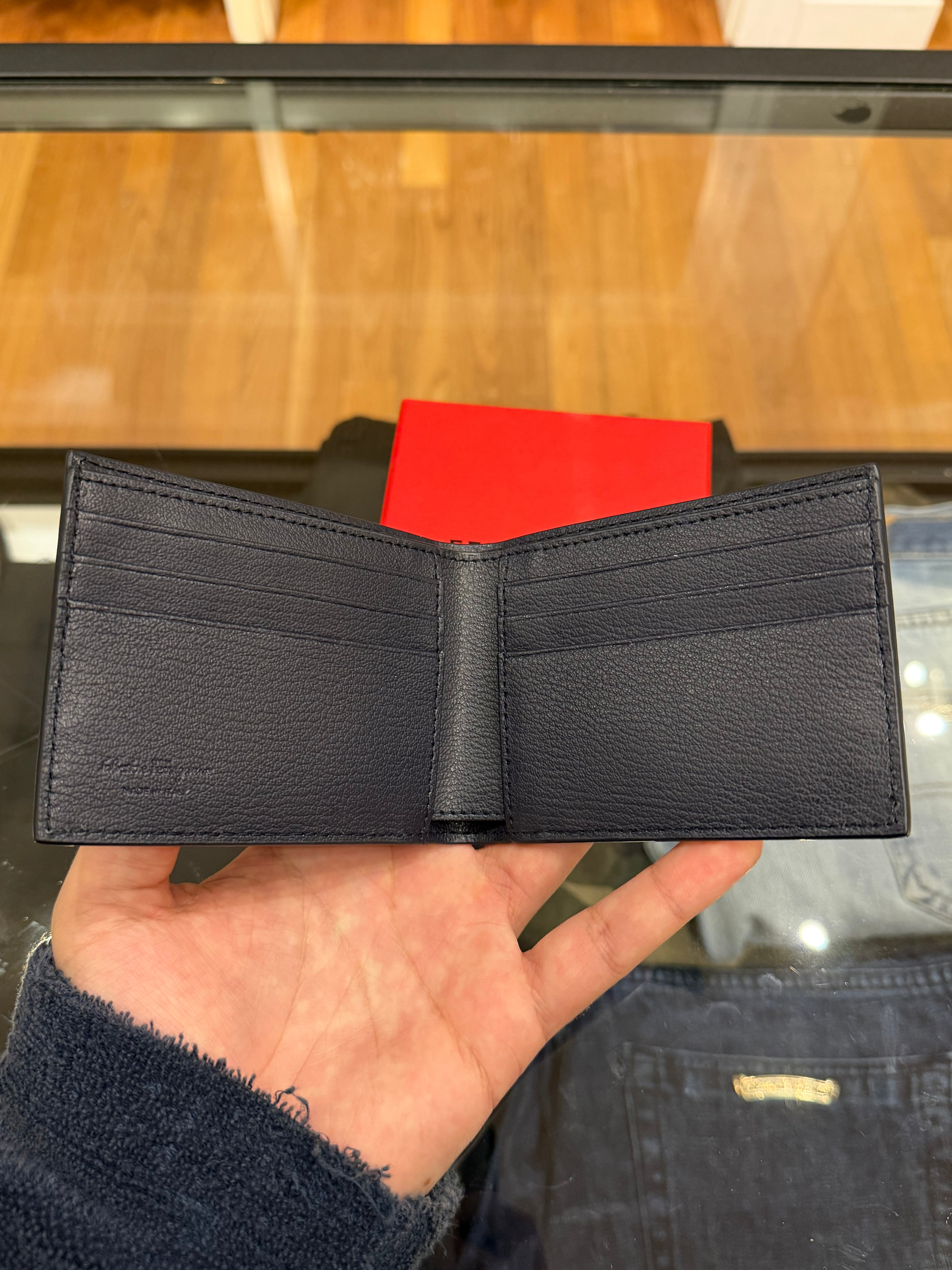 Salvatore Ferragamo Gancini Pattern Embossed Leather Bifold Wallet