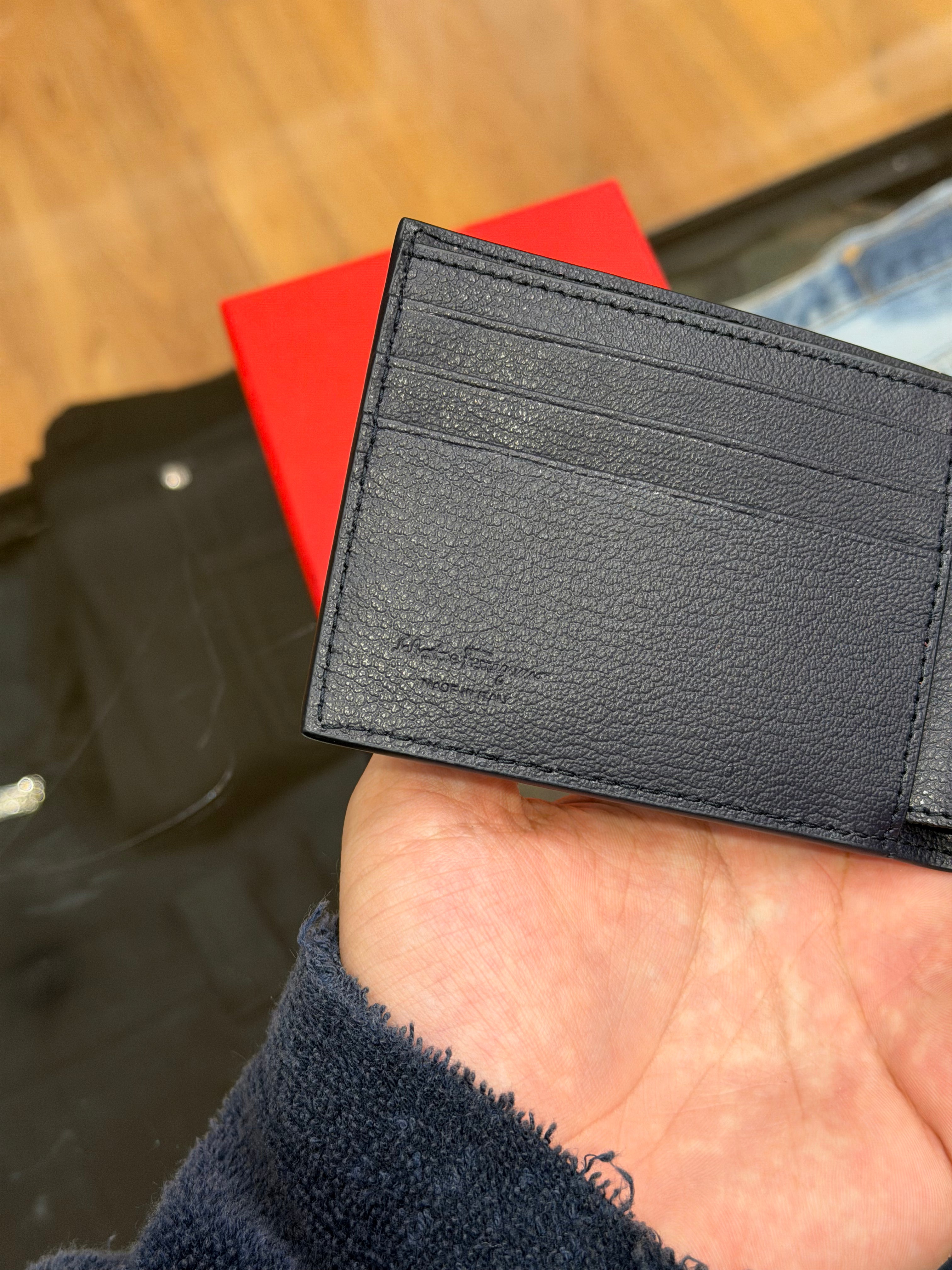 Salvatore Ferragamo Gancini Pattern Embossed Leather Bifold Wallet